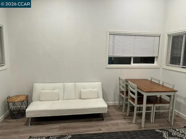 a bedroom with a bed and a night stand