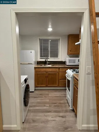 a living room with a bed and a window