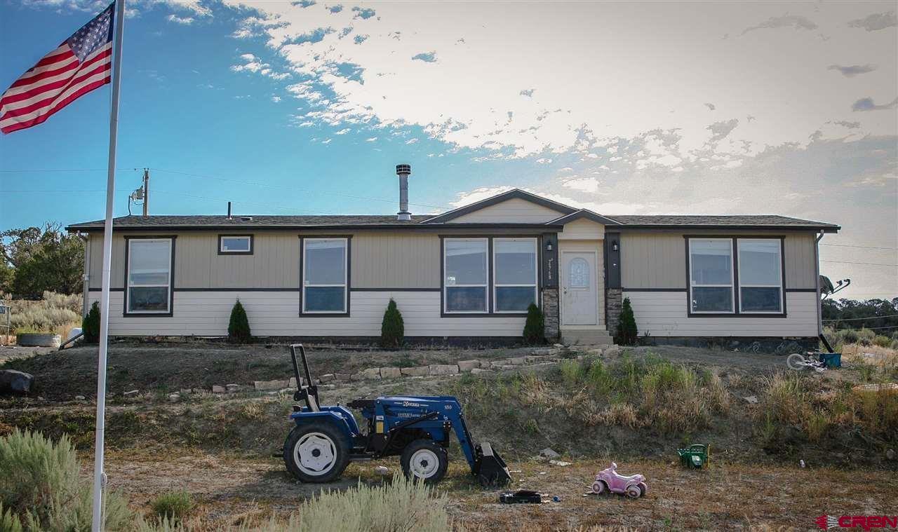 a house view with a backyard space