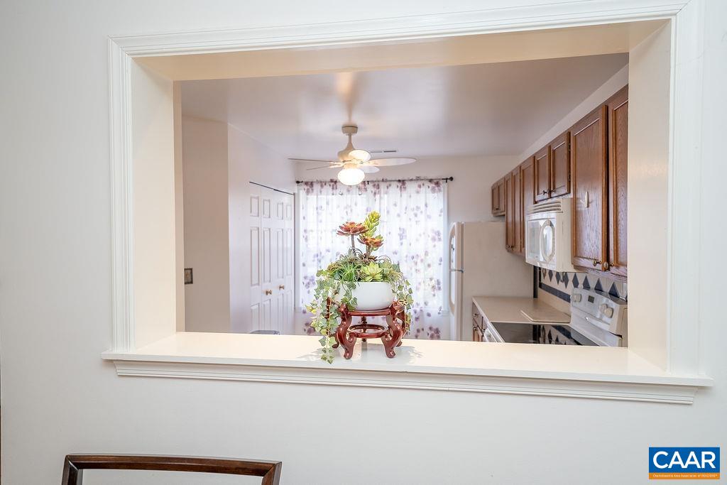 1302 Wimbledon Way Charlottesville, VA 22901 - Photo 16 of 60 a view of a dining room with a chandelier