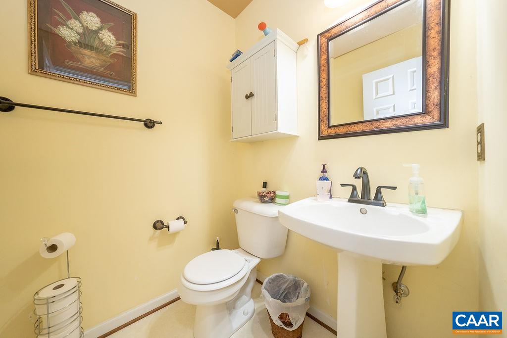 1302 Wimbledon Way Charlottesville, VA 22901 - Photo 17 of 60 a bathroom with a sink mirror and toilet