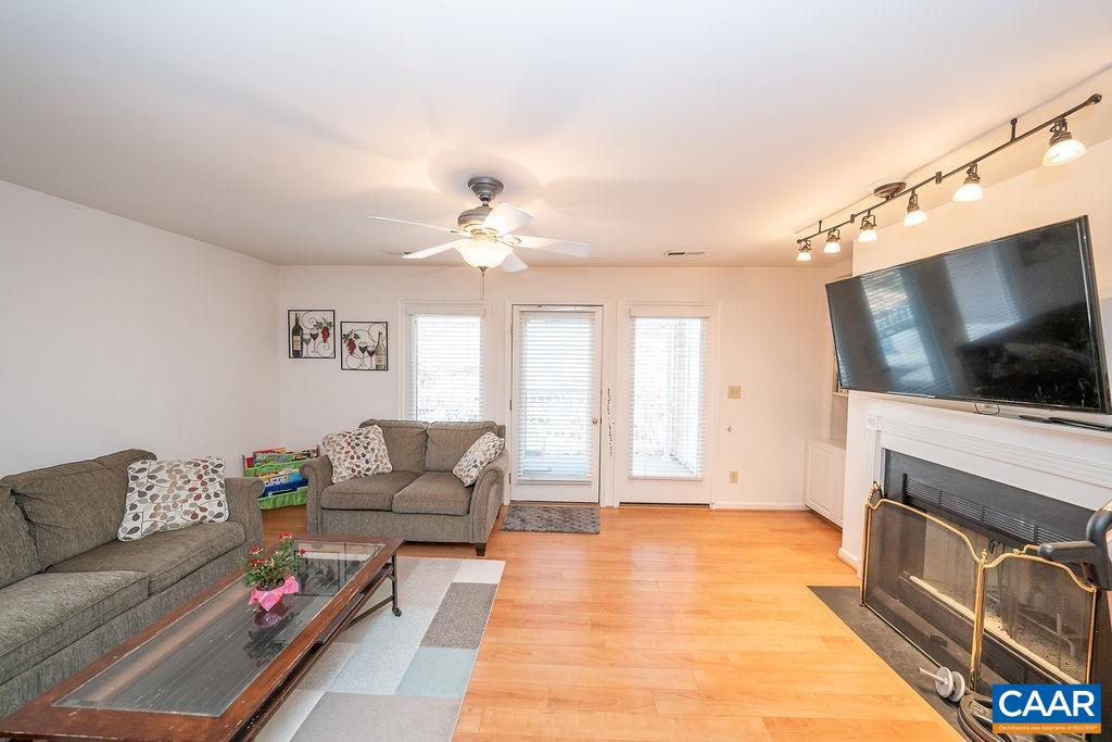 1302 Wimbledon Way Charlottesville, VA 22901 - Photo 20 of 60 a living room with furniture and a flat screen tv