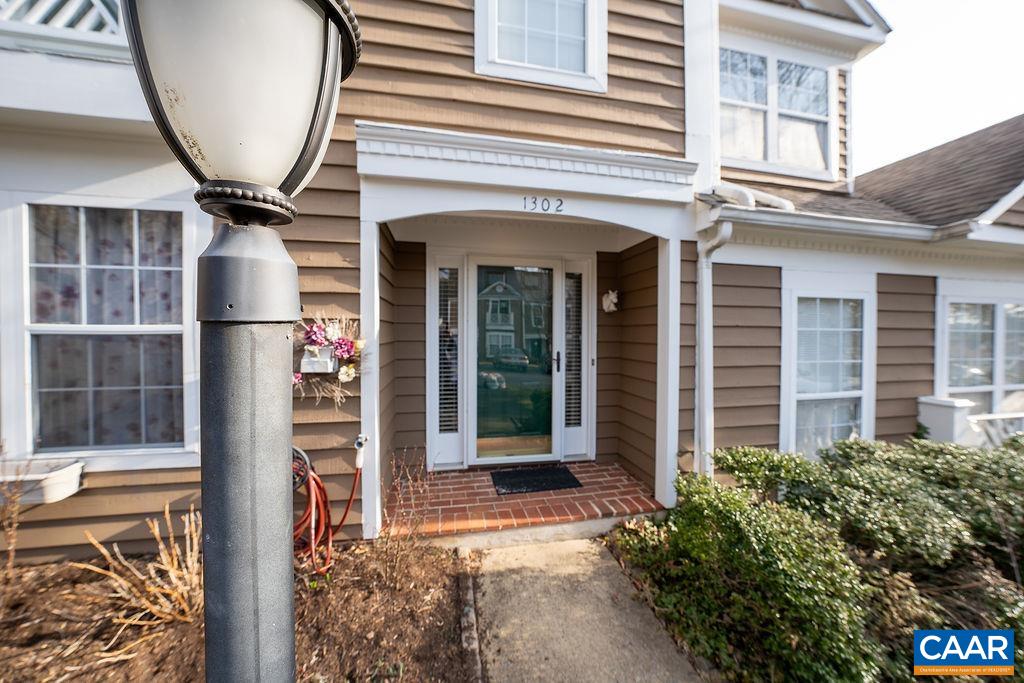 1302 Wimbledon Way Charlottesville, VA 22901 - Photo 2 of 60 front view of the house with a large windows