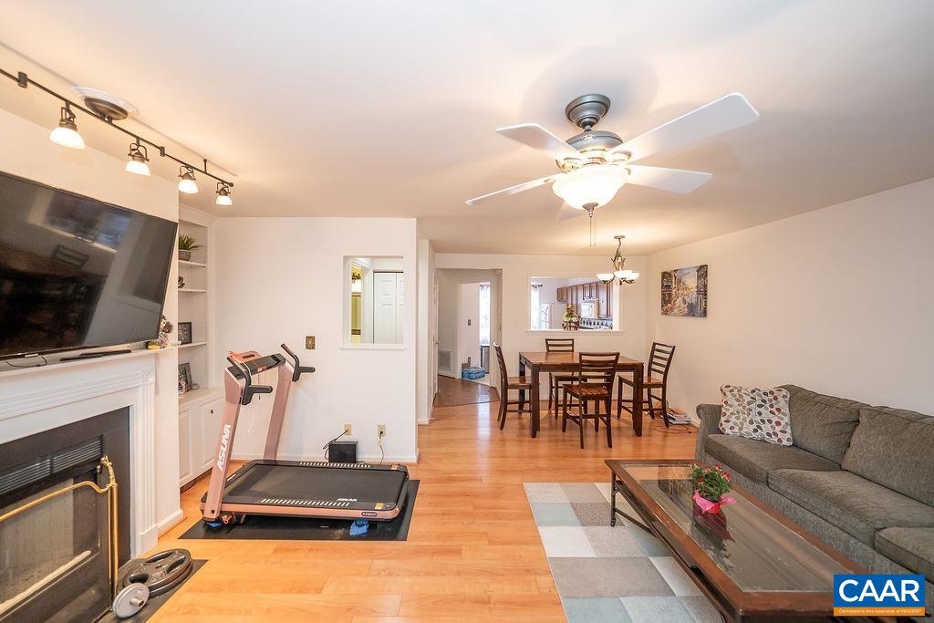 1302 Wimbledon Way Charlottesville, VA 22901 - Photo 23 of 60 a living room with furniture a fireplace and a flat screen tv