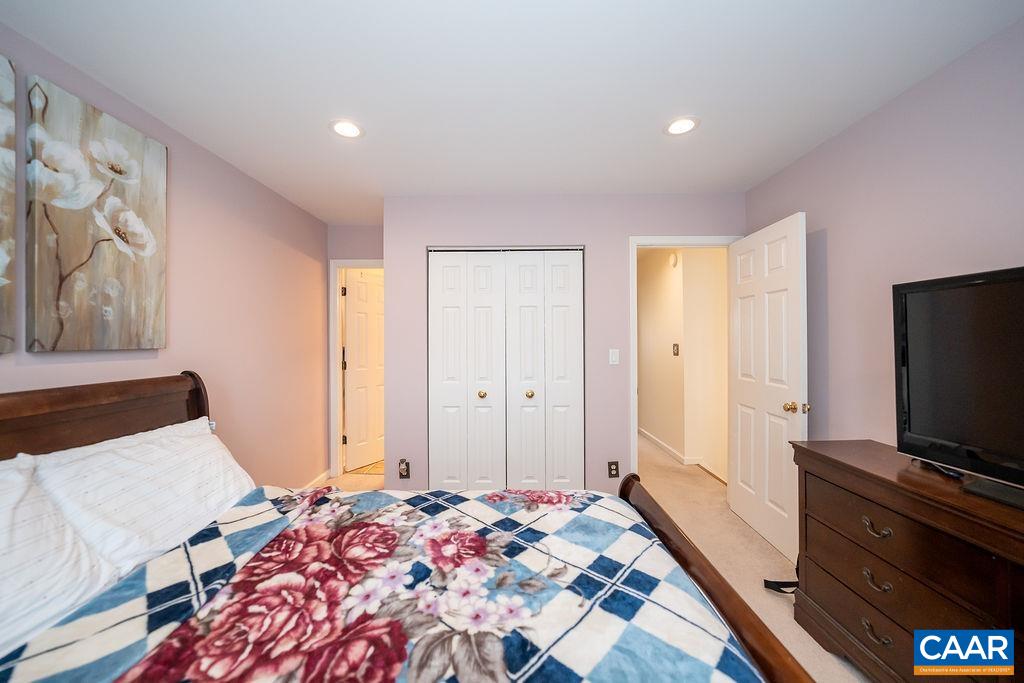1302 Wimbledon Way Charlottesville, VA 22901 - Photo 34 of 60 a bedroom with a bed and a flat screen tv