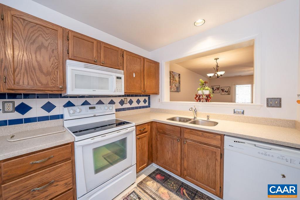 1302 Wimbledon Way Charlottesville, VA 22901 - Photo 4 of 60 a kitchen with a sink stove and cabinets
