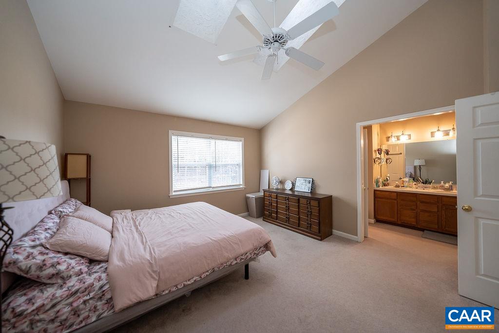 1302 Wimbledon Way Charlottesville, VA 22901 - Photo 42 of 60 a bedroom with a bed and a mirror