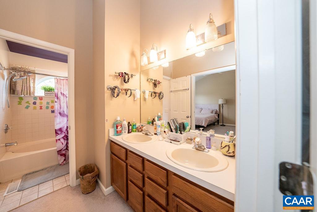 1302 Wimbledon Way Charlottesville, VA 22901 - Photo 45 of 60 a bathroom with a sink and a mirror