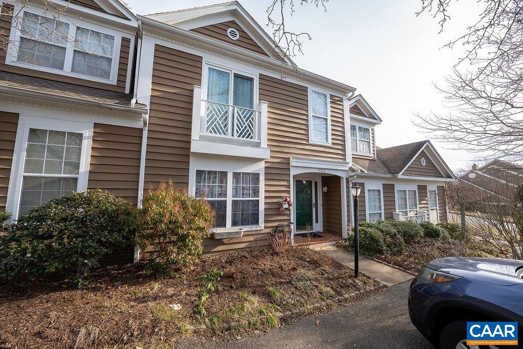 1302 Wimbledon Way Charlottesville, VA 22901 - Photo 53 of 60 a view of a house with a yard and potted plants