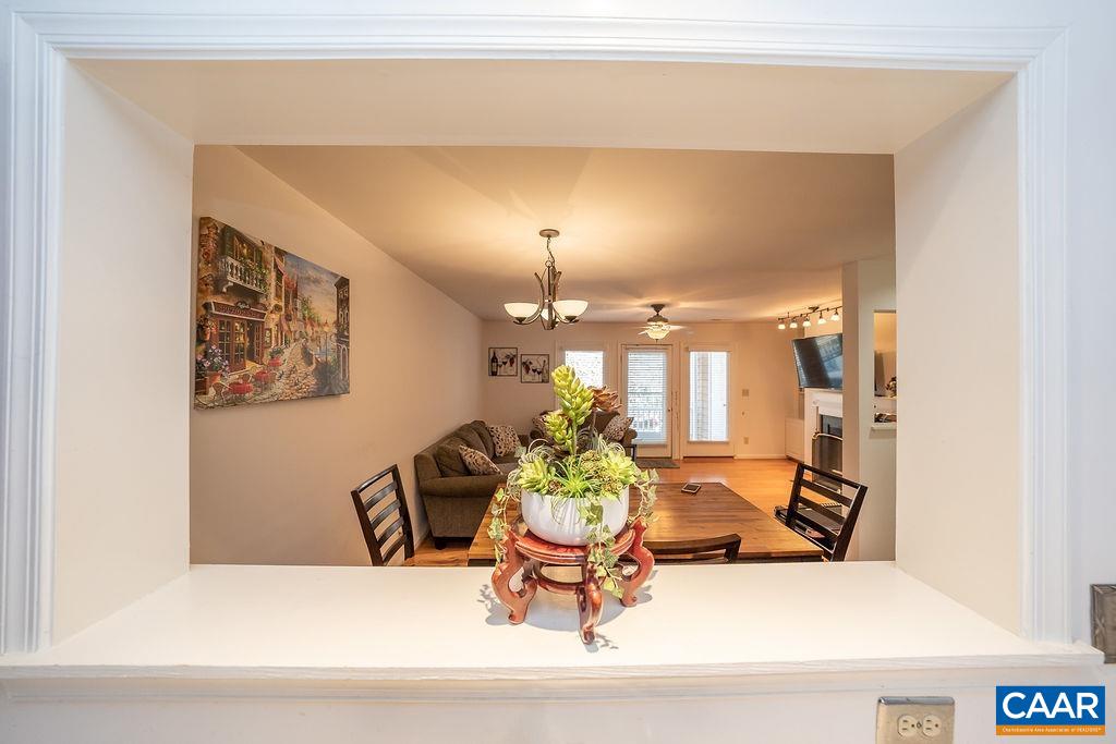1302 Wimbledon Way Charlottesville, VA 22901 - Photo 6 of 60 a living room with furniture and a chandelier