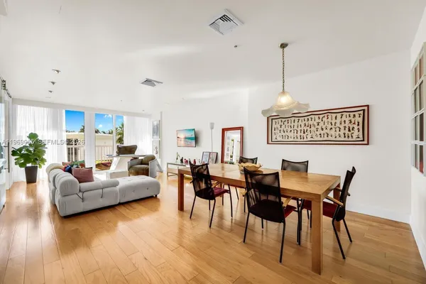 a view of a livingroom with furniture and wooden floor