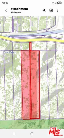 a view of a living room and kitchen with an oven