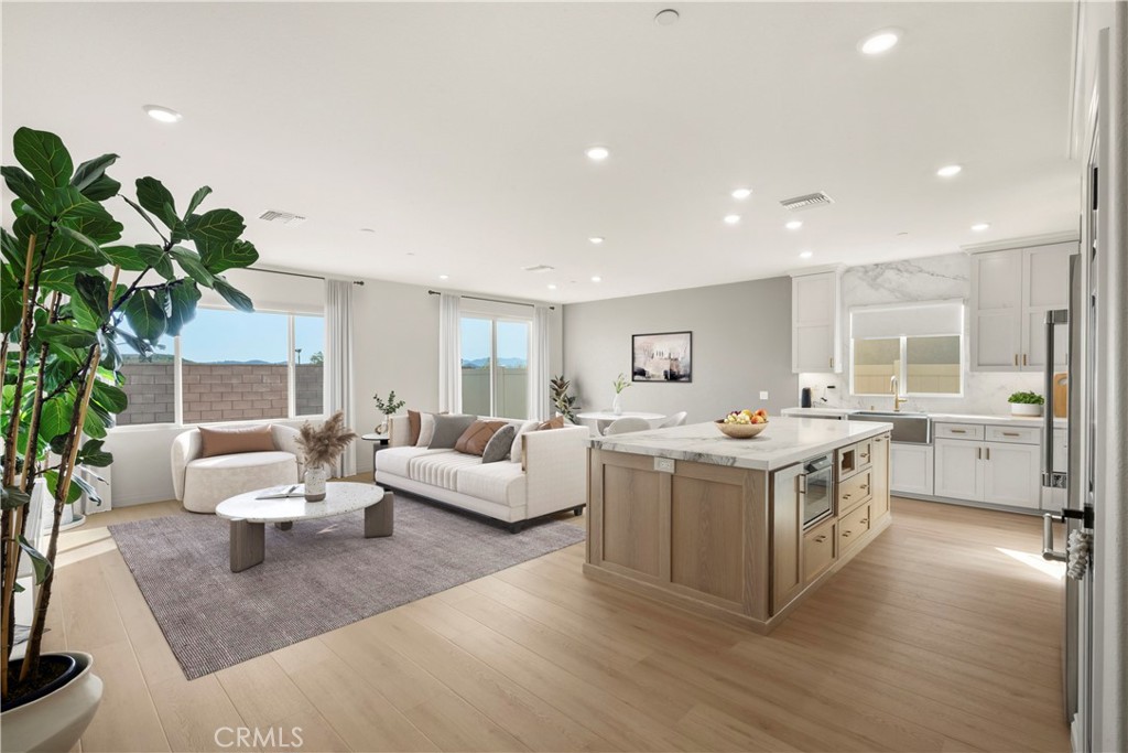 19795 Beavertail Way Riverside, CA 92508 - Photo 12 of 39 Great Room - showing family room, dining area and kitchen - Virtually Staged.