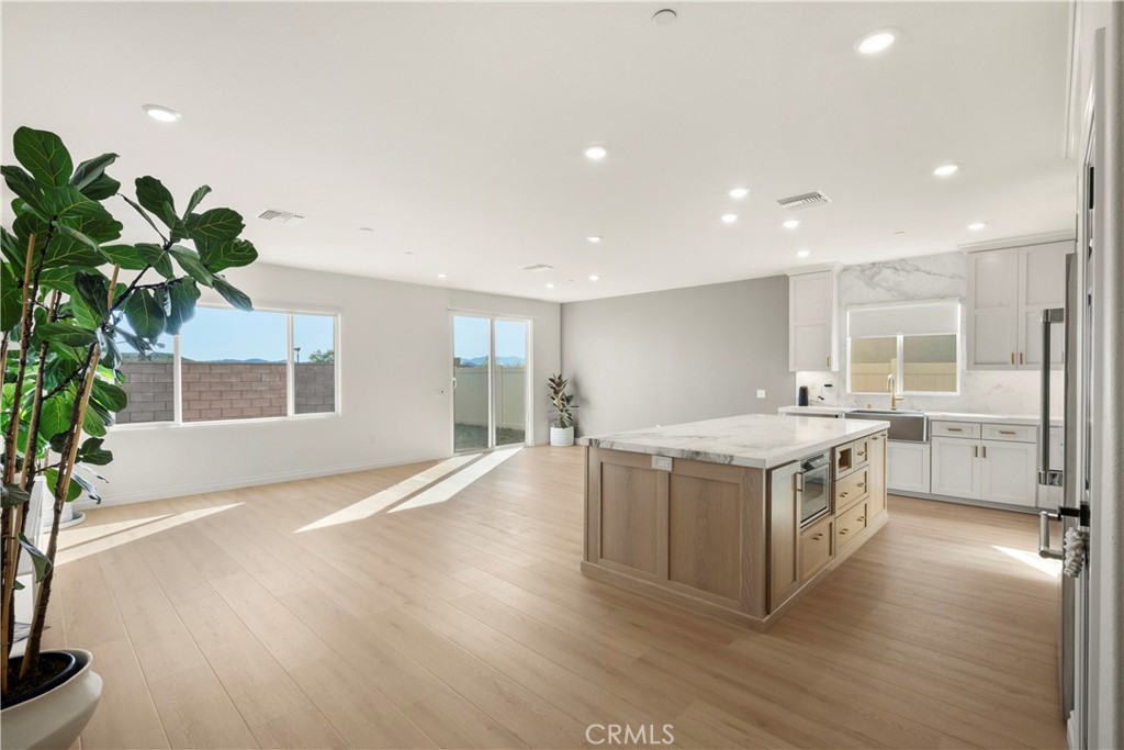 19795 Beavertail Way Riverside, CA 92508 - Photo 13 of 39 Great Room - showing family room, dining area and kitchen