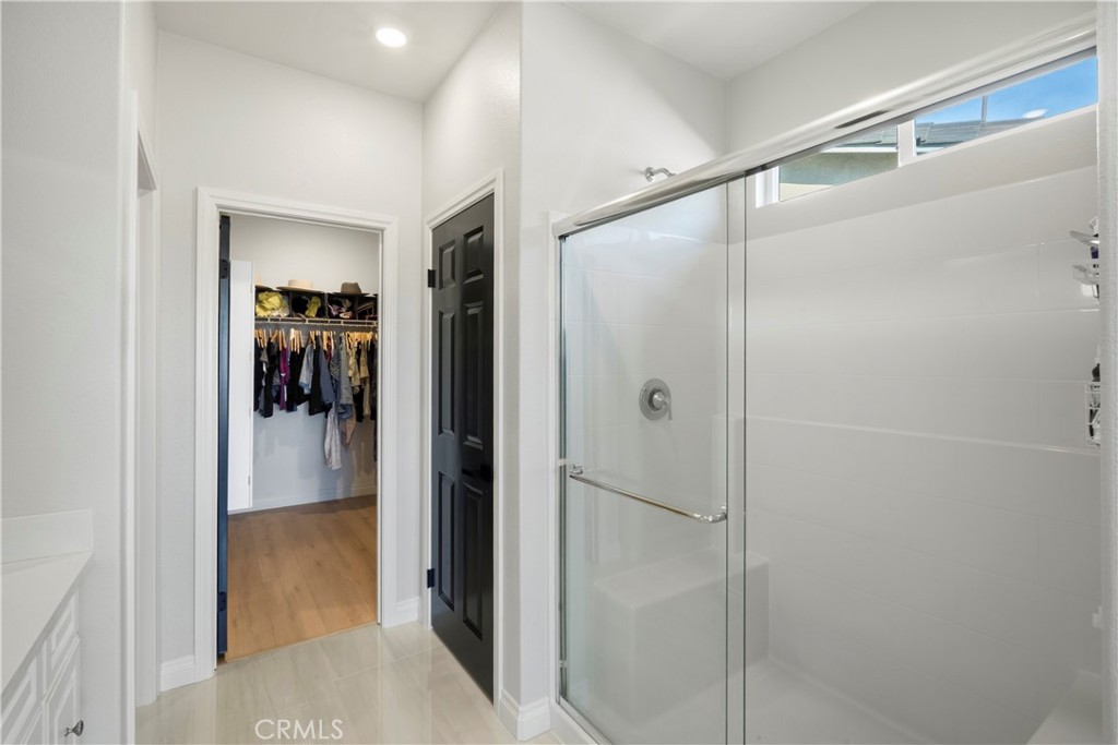 19795 Beavertail Way Riverside, CA 92508 - Photo 23 of 39 Primary Bathroom with Walk In Closet and Shower