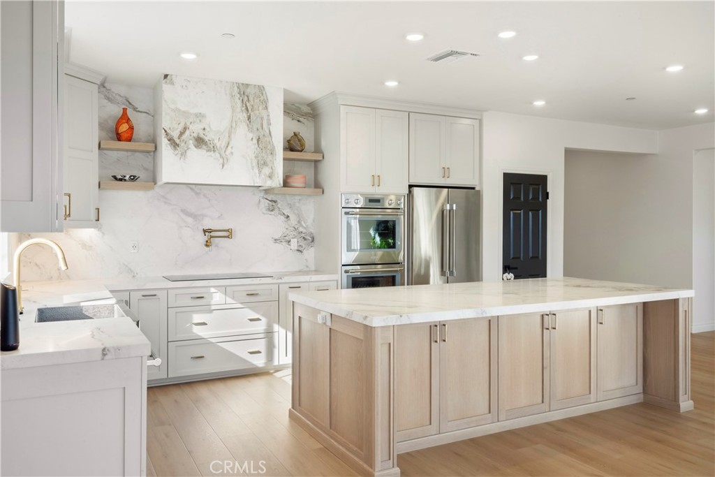 19795 Beavertail Way Riverside, CA 92508 - Photo 4 of 39 Upgraded Kitchen with Calcutta Honed Marble and Thermador Appliances