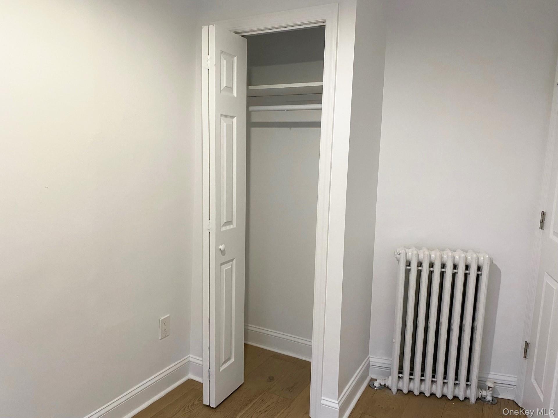 153 Southside Avenue Hastings-on-Hudson, NY 10706 - Photo 10 of 12 an empty room with wooden floor