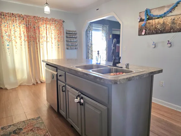 a room with a sink and a window