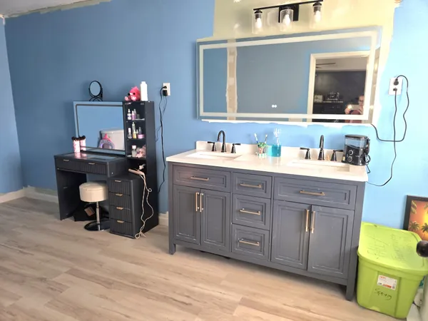 a bathroom with a sink and a mirror