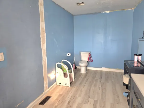 a bed room with a bed and furniture