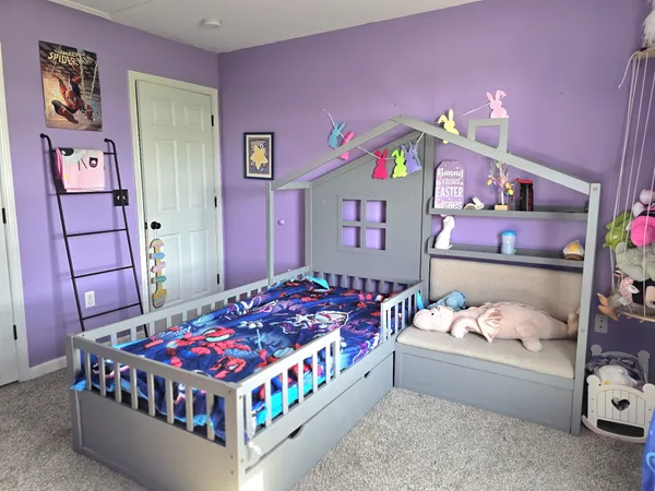 a bedroom with furniture and a window