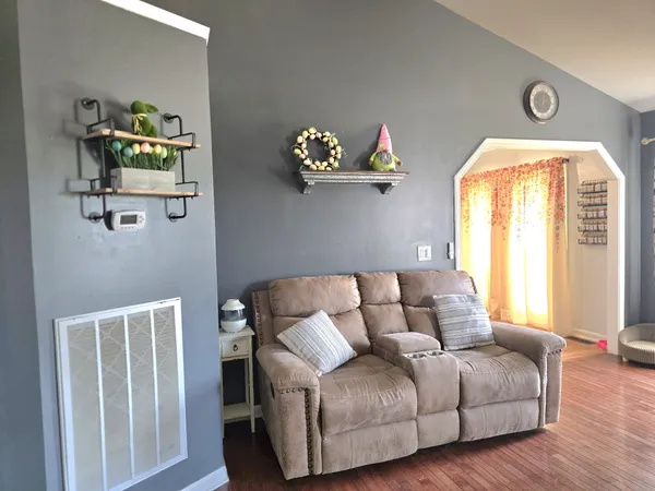a living room with furniture and a window