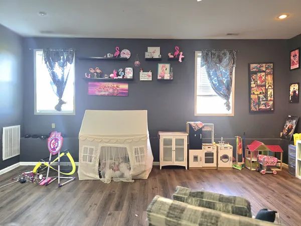 a room with toys and wooden floor