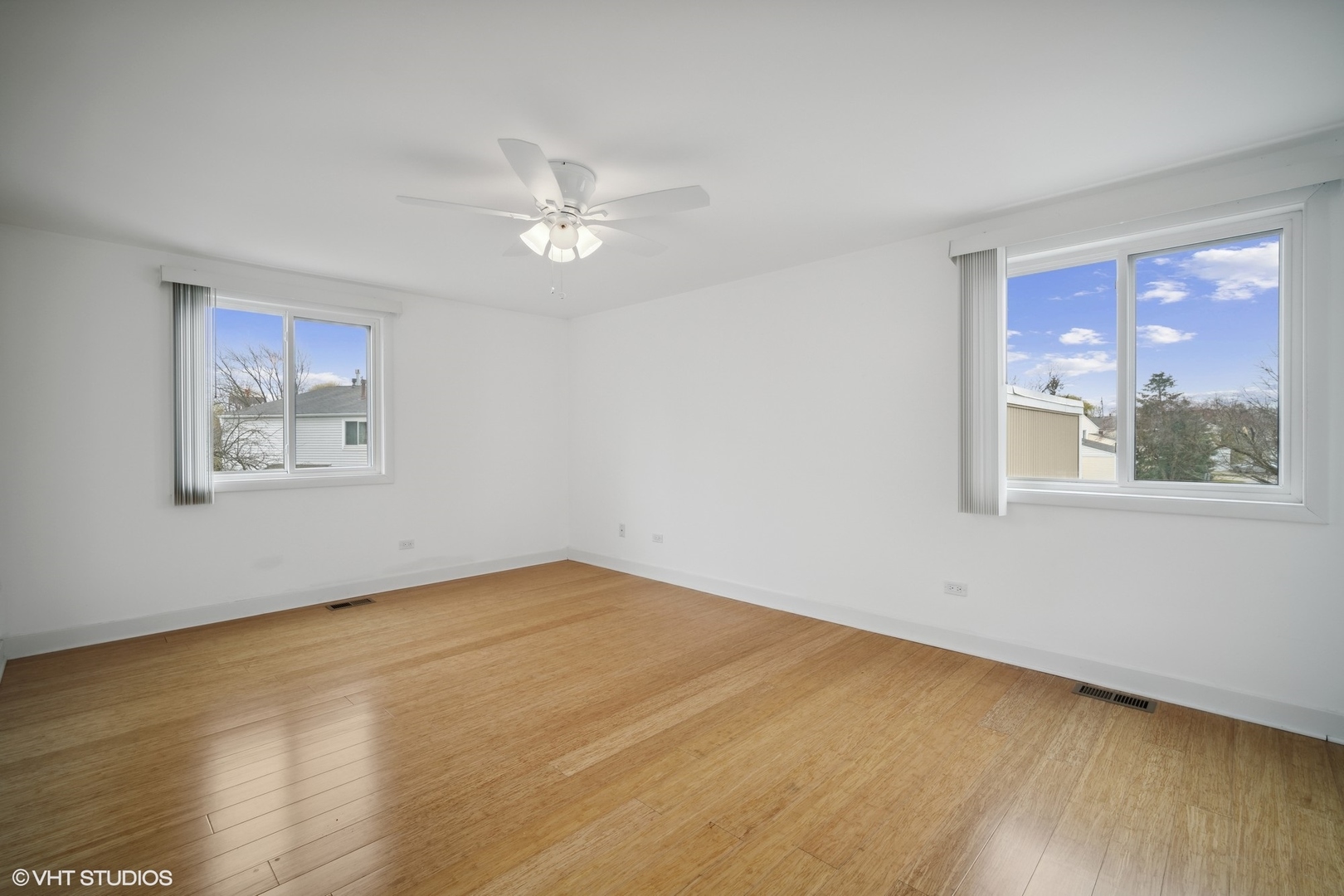 766 Barnaby Place Wheeling, IL 60090 - Photo 15 of 22 a view of empty room with wooden floor and fan