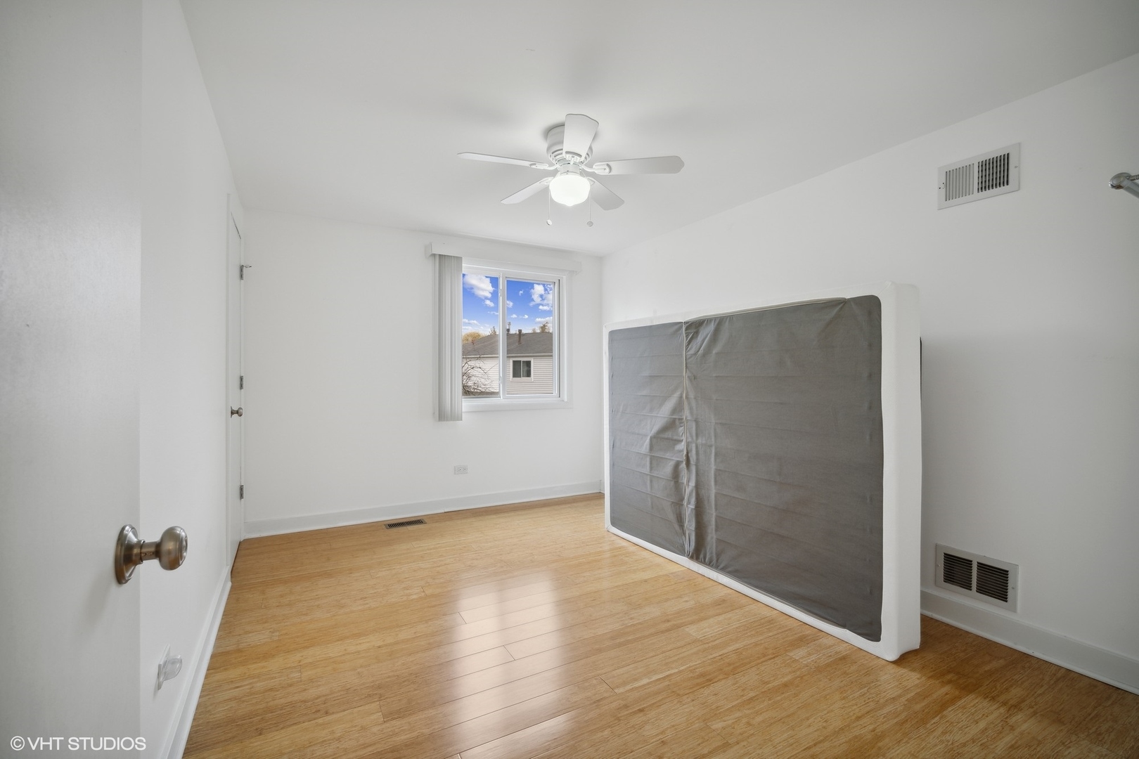 766 Barnaby Place Wheeling, IL 60090 - Photo 17 of 22 an empty room with wooden floor and a ceiling fan