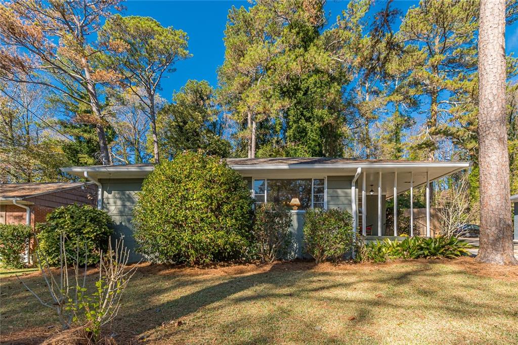 947 Pegg Road East Point, GA 30344 - Photo 1 of 1 a view of a house with a small yard and plants