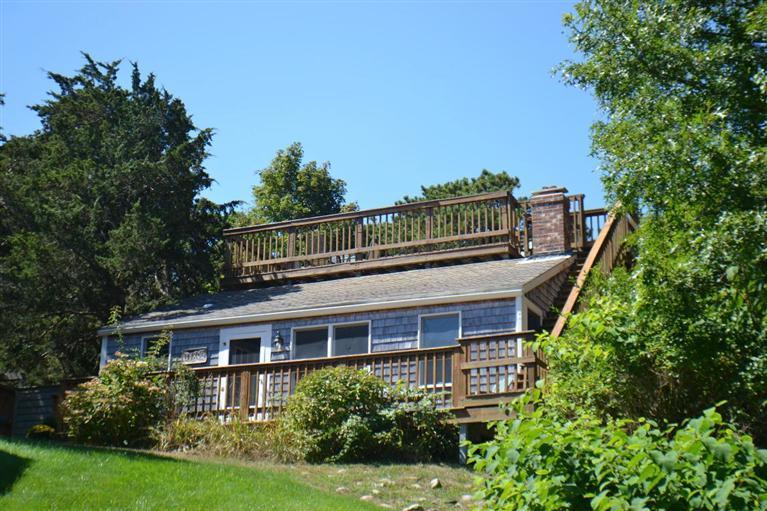 4 Seaview Road, Unit 5 Orleans, MA 02653 - Photo 3 of 17 a front view of a house with a yard