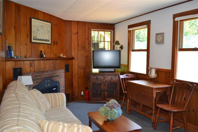4 Seaview Road, Unit 5 Orleans, MA 02653 - Photo 8 of 17 a living room with furniture and a flat screen tv