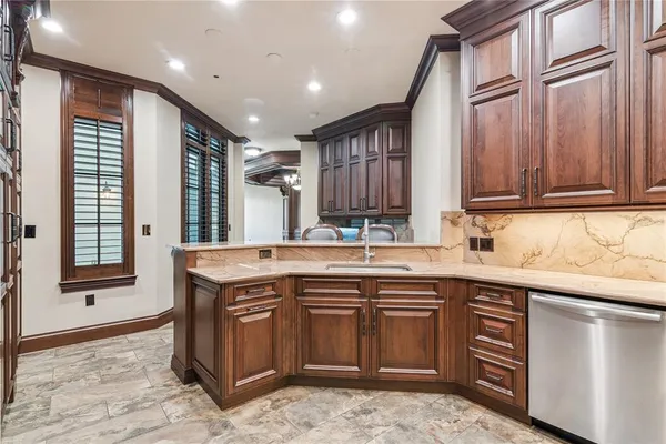 a kitchen with a sink stove and cabinets