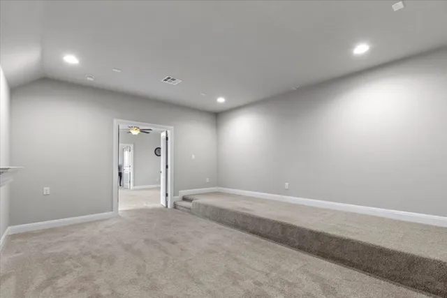 a bedroom with a bed and a desk