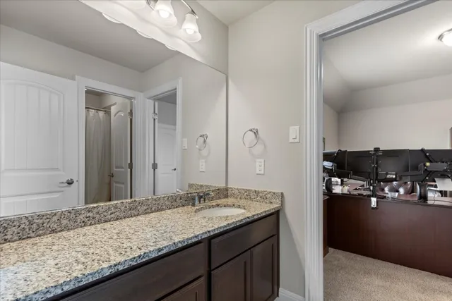 a work room with furniture and a bookshelf