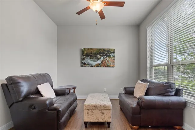 a view of a dining room with furniture and window