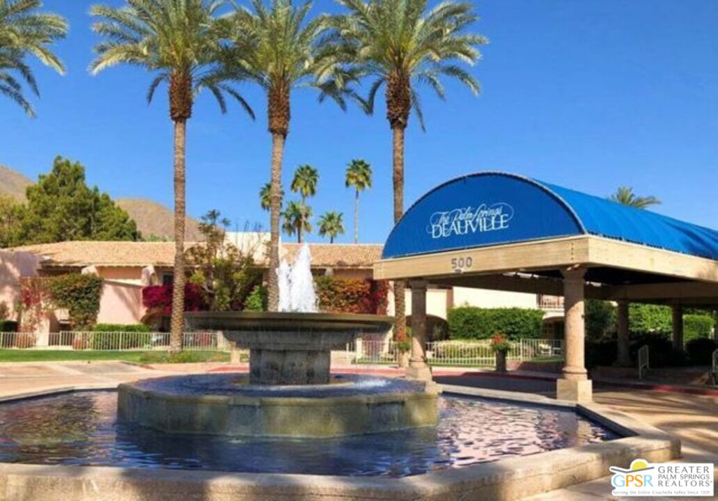 a view of a swimming pool with a table and chairs