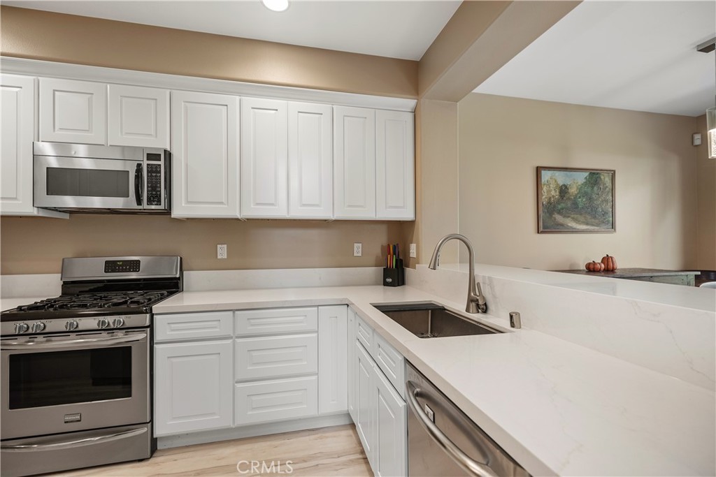 38 Red Bud Aliso Viejo, CA 92656 - Photo 8 of 28 Updated kitchen with quartz counters.