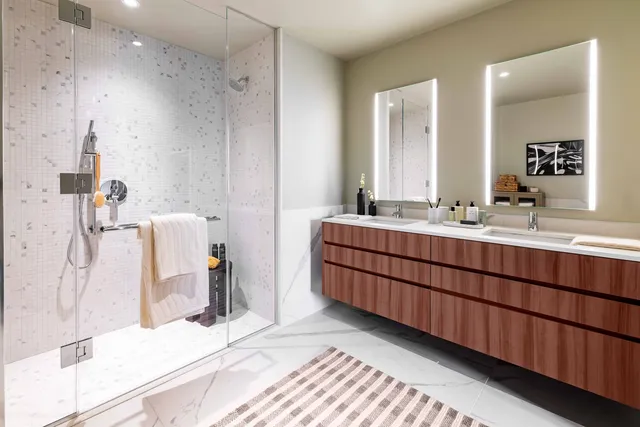 a bathroom with a double vanity sink mirror and double