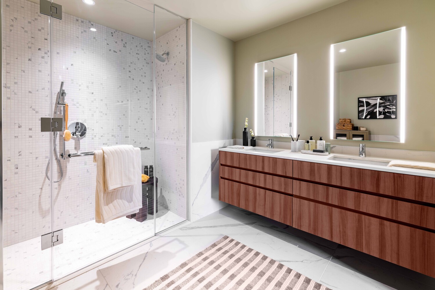 300 East 50th Street, Unit 22B Manhattan, NY 10022 - Photo 10 of 22 a bathroom with a double vanity sink mirror and double