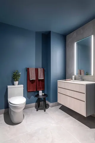 a room with a chair and a mirror