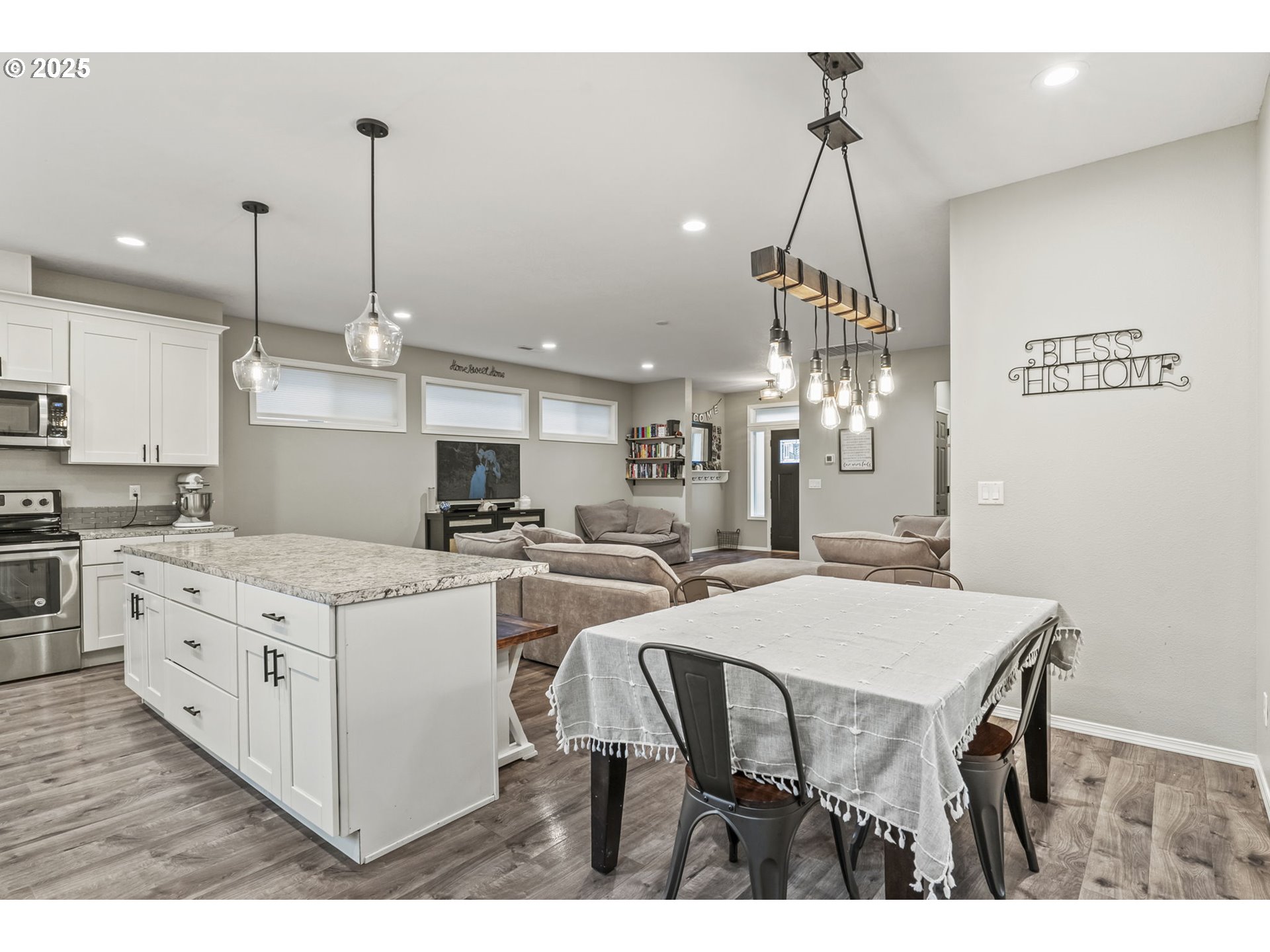 1783 Lewis River Road Woodland, WA 98674 - Photo 14 of 32 a kitchen with stainless steel appliances kitchen island a chandelier