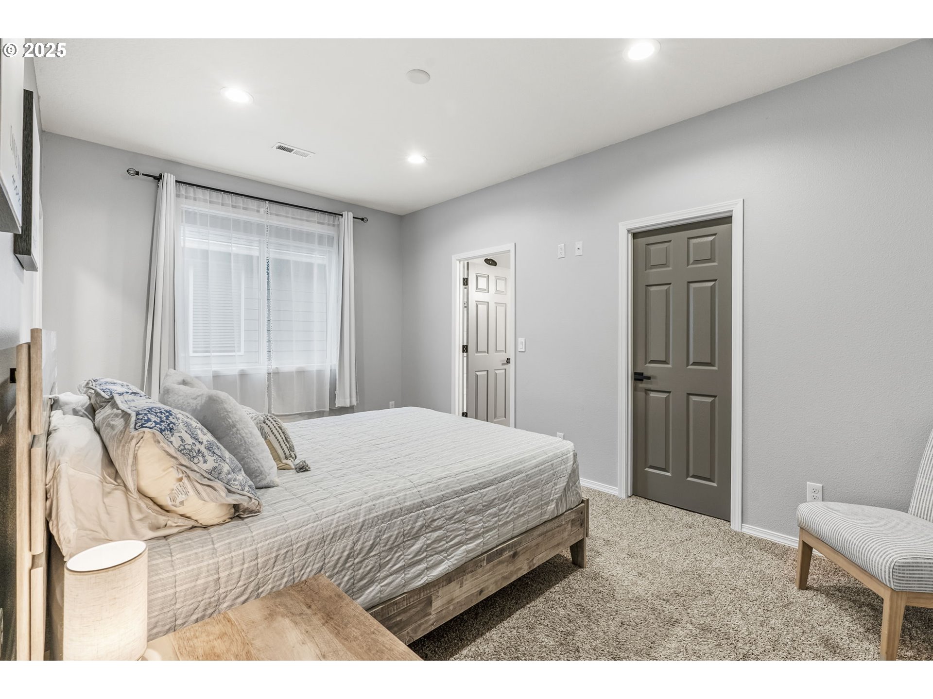 1783 Lewis River Road Woodland, WA 98674 - Photo 18 of 32 a bedroom with a bed and a chair