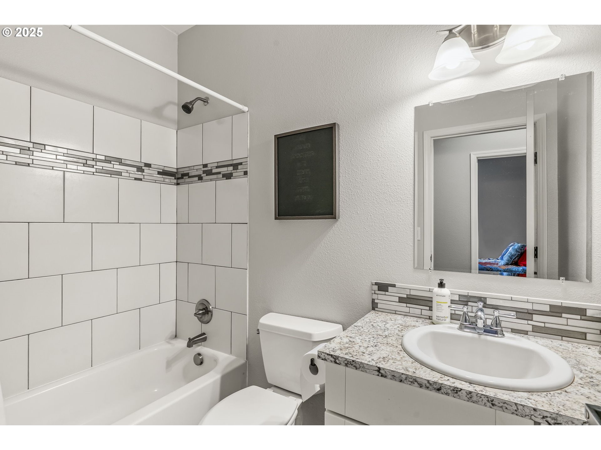 1783 Lewis River Road Woodland, WA 98674 - Photo 24 of 32 a bathroom with a granite countertop sink a toilet a mirror and bathtub