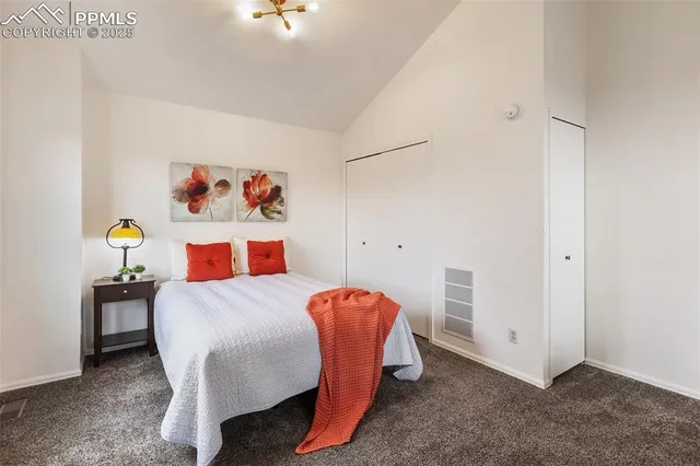 a bedroom with a bed and a table