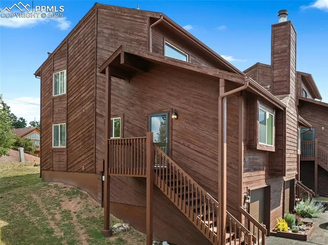 a front view of a house with parking space