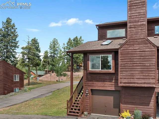 a view of a house with a snow in the yard