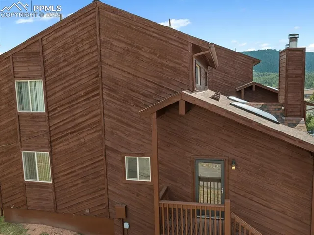 a view of a house with iron stairs