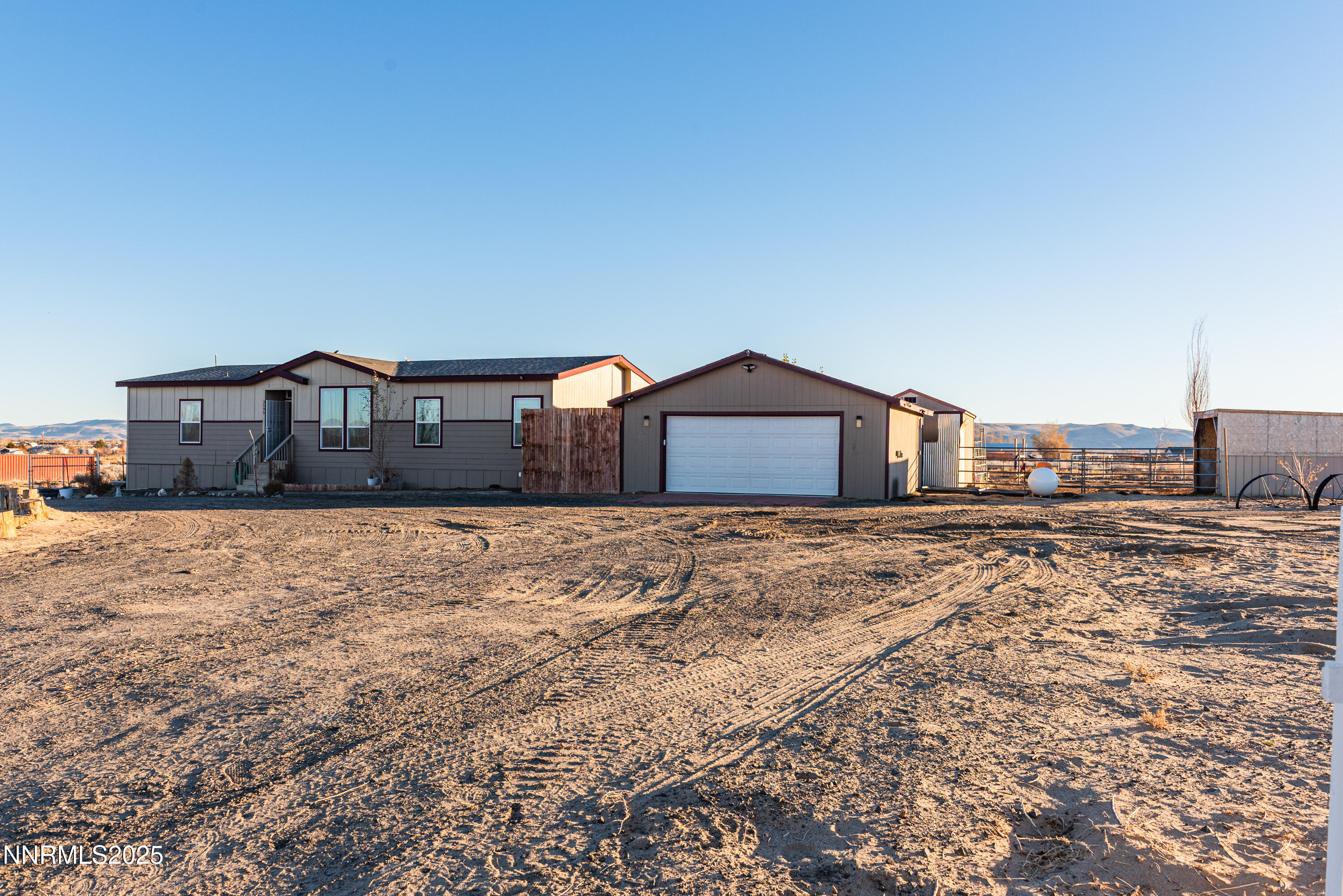 2595 4th Street Silver Springs, NV 89429 - Photo 2 of 54 a house view with a wooden fence