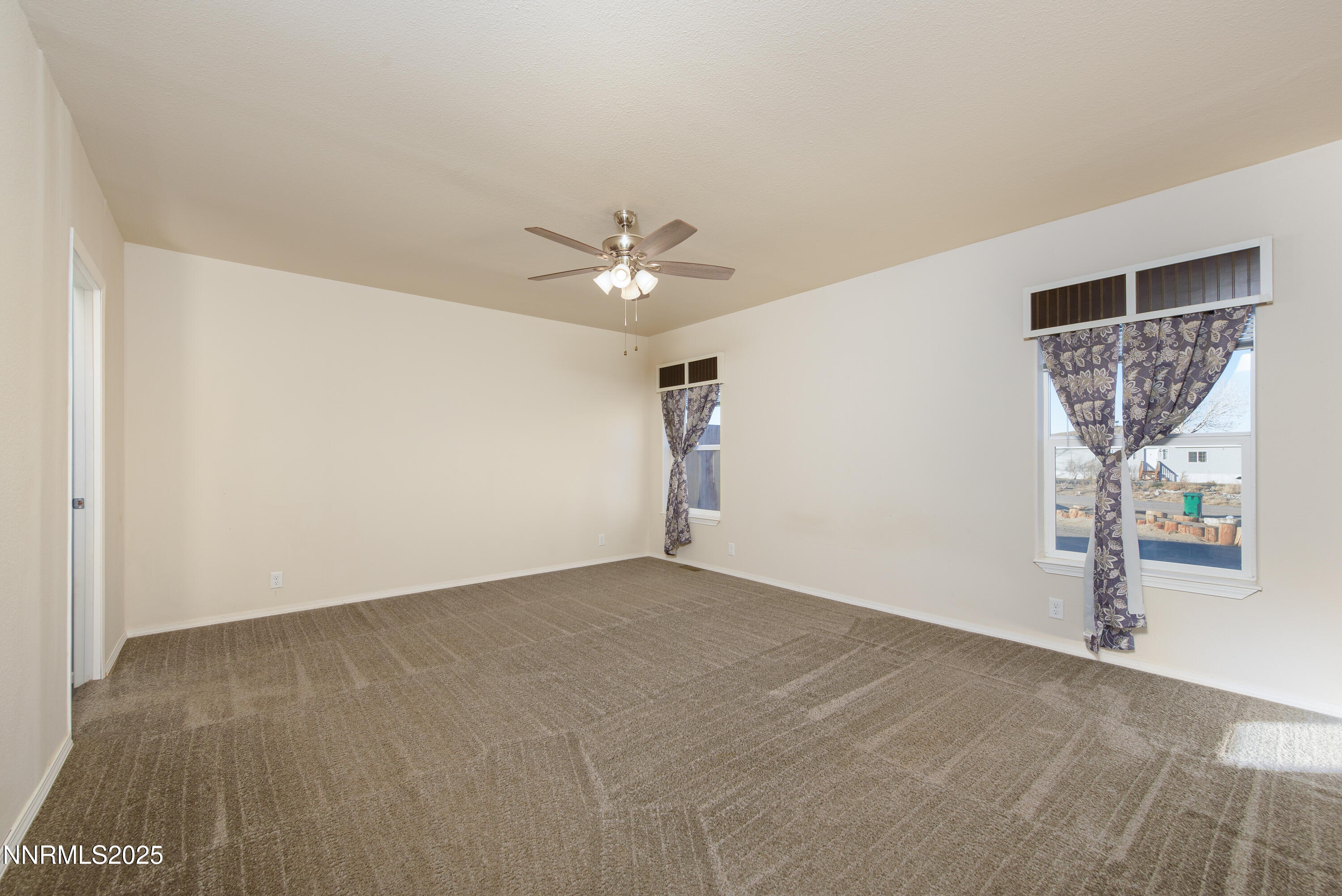 2595 4th Street Silver Springs, NV 89429 - Photo 22 of 54 wooden floor in an empty room with a window